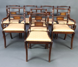 A set of 8 Georgian style bar back dining chairs raised on sabre supports with upholstered drop in seats, 2 carvers and 6 standard  