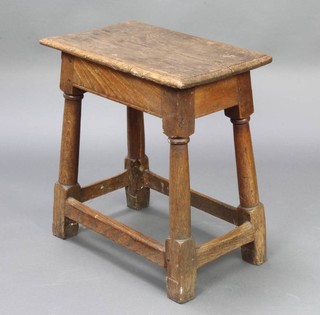 An 18th Century style oak joined stool raised on turned and block supports 54cm h x 52cm w x 31cm d 