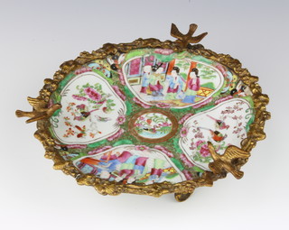 A 19th Century Cantonese plate decorated with panels of figures and birds mounted on a gilt stand with gilt rim and birds 21cm 