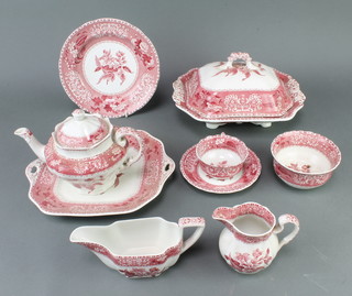 A Spode pink Camilla pattern tea and dinner service comprising 6 tea cups, 6 saucers, teapot, milk jug and sugar bowl,  6 small plates, 6 medium plates, 6 dinner plates, 6 side plates, 6 dessert bowls, 6 soup bowls, a sauce boat, a tureen cover and stand, a tureen and cover, a slop bowl, 3 meat plates