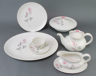 A Royal Doulton Pillar Rose tea and dinner service comprising 9 tea cups, 12 saucers, 2 tea pots (1af), milk  jug, sugar bowl and slop bowl, 12 small plates, 12 medium plates, 12 large plates, 12 dessert bowls, 12 soup bowls, 2 sauceboats and stands, a vegetable dish, 3 tureens and covers, 3 meat plates 