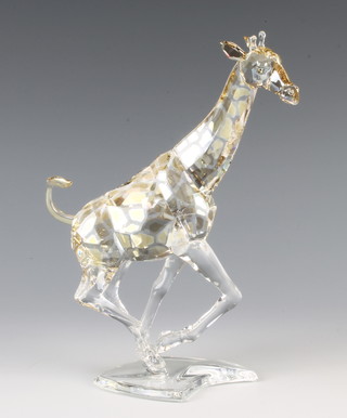 A Swarovski Crystal Giraffe running in coloured crystal by Heinz Tabertshofer 935896/9100000103 2008 17cm boxed