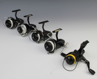 Two Mitchell 300 fishing reels, 2 Mitchell 810 reels and a Shimano TX-7 reel  