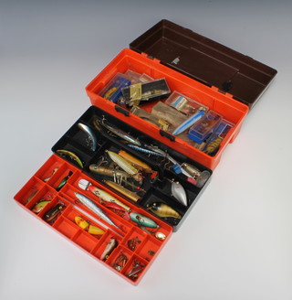 A plastic lure box containing a collection of lures including Abu etc 