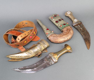 A Jambuka with 18cm blade contained in a decorative metal and leather scabbard together with 1 other with 20cm blade and leather scabbard 