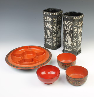 A pair of 19th Century Japanese octagonal ebonised and inlaid mother of pearl vases 27cm h x 12cm w x 12cm d, together with a circular red lacquered segmented bowl 29cm, 2 Indian circular lacquered bowls 5cm x 11cm and a red lacquered bowl 7cm x 12cm  