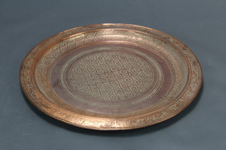 A large engraved copper charger 76cm diam. 