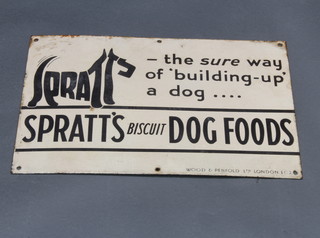 A black and white enamelled sign "Spratts of Spratt The sure way to build up a dog .... Spratts biscuit dog foods Wood and Penfold Ltd London" 31cm x 46cm 