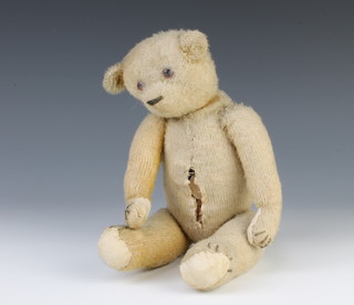 A yellow teddy bear with articulated limbs 32cm 