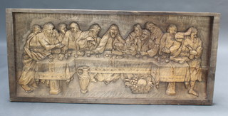 A rectangular carved wooden panel depicting The Last Supper 63cm h x 139cm w x 5cm d