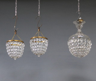 A circular glass bag shaped light fitting 37cm h x 29cm diam. together with a similar pair of light fittings 18cm x 16cm 