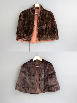 A lady's black fur cape and 1 other 