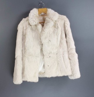 A lady's white fur jacket 