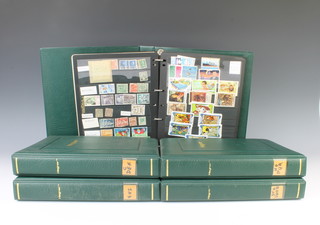 Five green Hagner albums of world stamps A-Z 