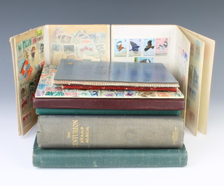 A green Swiftsure album of mint and used world stamps, a Centurion album of world stamps, a stock book of Colombian and Cuban stamps, a Pacific album of stamps, exercise book of Czechoslovakian stamps, a CB album of stamps, album of Hungarian stamps and 2 small stock books of Hong Kong and world stamps  