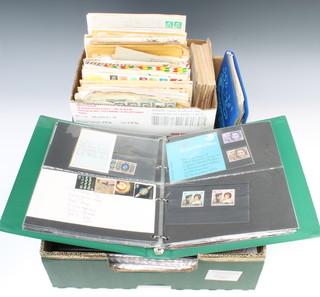 A green album containing Elizabeth II presentation stamps and first day covers, 3 albums of GB first day covers and a collection of World first day covers 