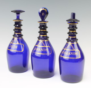 Three 19th Century Bristol blue and gilt decorated spirit bottles Rum, Brandy and Hollands 24cm