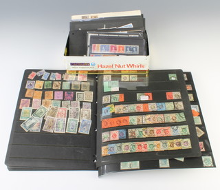 A collection of loose leaf stamps including Victorian Hong Kong, Commonwealth and later together with a small tin containing various loose world stamps 