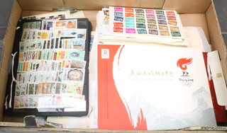 A 1989 souvenir collection of Canadian postage stamps, 12 annals of Lunar New Year stamp collection, a 2008 Beijing stamp collection and various used world stamps 
