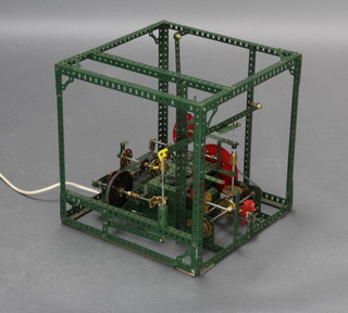 A green and red Meccano electrically operated model 33cm h x 32cm w x 32cm d 