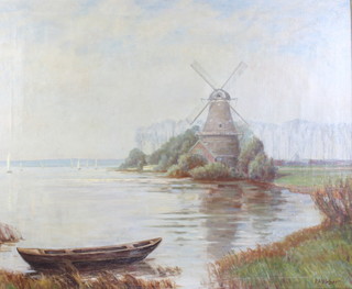 P A Weber, oil on  canvas, signed, a Dutch riverscape with windmills and boats 59cm x 70cm 