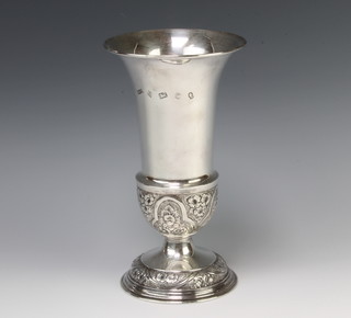 A repousse silver vase with splayed lip and floral decoration Birmingham 1977, maker S J Rose & Son, 400 grams, 23cm 