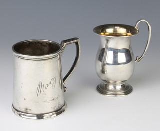 A silver mug of tapered form inscribed Mary, Birmingham 1919, 1 other, 192 grams 