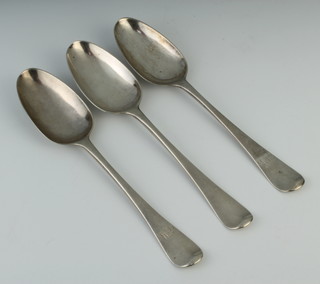 Three George II silver table spoons with chased monogram London 1751