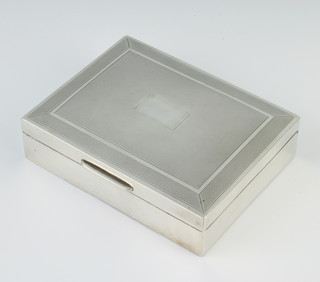 A rectangular engine turned silver cigarette box Birmingham 1962 11cm x 9cm x 3cm 