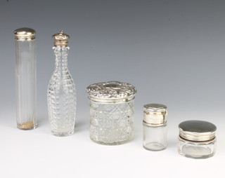 A silver mounted toilet jar Birmingham 1922, 4 other mounted bottles 