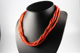 A coral bead necklace with an 18ct yellow gold clasp 44cm 