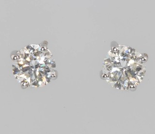 A pair of 18ct white gold single stone diamond ear studs approx. 1.06ct  