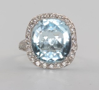 A platinum chequerboard cut topaz and diamond cluster ring, size L 