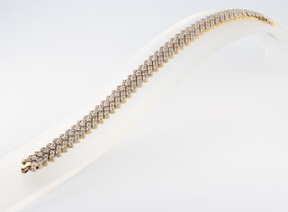A 14ct yellow gold diamond set bracelet 18.5cm, 30.8 grams