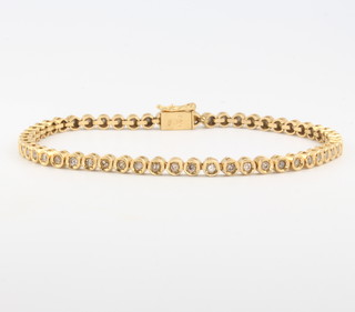 An 18ct yellow gold bracelet set with 55 brilliant cut diamonds 18cm