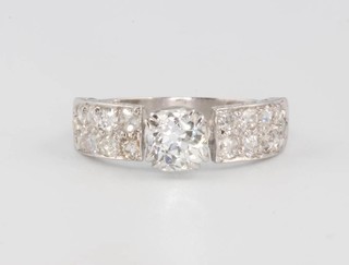 A platinum diamond ring the centre stone 0.5ct the shoulders with brilliant cut diamonds size L 1/2 