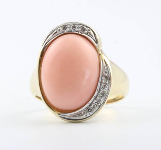 A 14ct yellow gold cabochon cut coral and diamond ring size M 