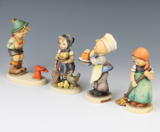 Four Hummel figures - boy with rabbit 12cm, Feeding Time 10cm, Little Sweeper 10cm, Baker 12cm 