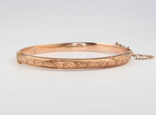 A 9ct rose gold chased bangle 5.3 grams 