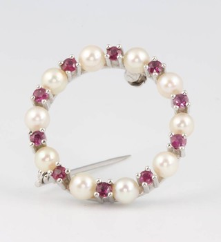 An 18ct white gold ruby and pearl brooch 