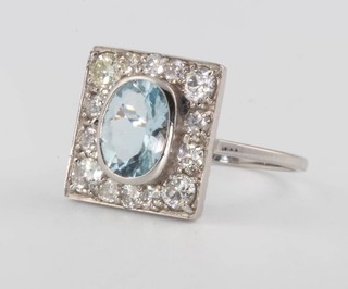 An 18ct white gold Art Deco style oval aquamarine and diamond square ring size M 1/2
