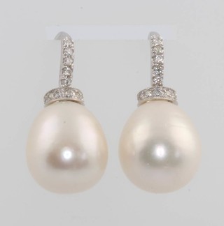 A pair of 18ct white gold cultured pearl and diamond drop earrings 