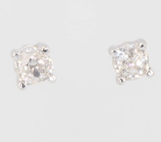 A pair of 18ct white gold single stone diamond ear studs approx. 0.56ct 