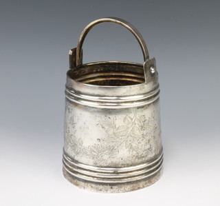 An early 20th Century Russian silver pail decorated with flowers 22cm to handle, 501 grams