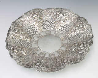 A Continental repousse silver dish decorated with fruits and flowers 24cm 318 grams 