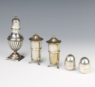 A pair of Victorian silver tumbling condiments and 3 others, the condiments Sheffield 1887, 259 grams