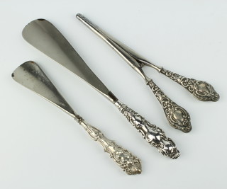A pair of silver mounted glove stretchers and 2 shoe horns 