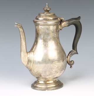 An Art Deco Queen Anne style silver coffee pot with ebony handle, Sheffield 1934, 23cm, 772 grams gross 