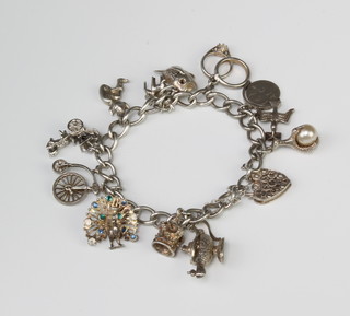 A silver charm bracelet, 43 grams