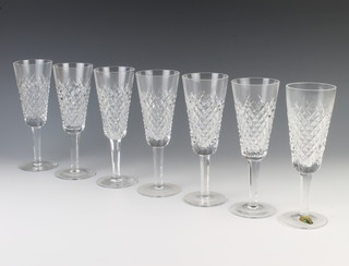 A set of 6 Waterford Crystal champagne glasses with hobnail decoration 